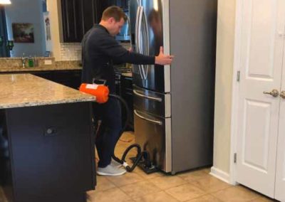 Moving a large refrigerator with an Airsled