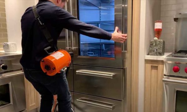 Airsled appliance mover moving a sub zero fridge