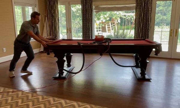 Using an airsled to move a pool table across a wooden floor